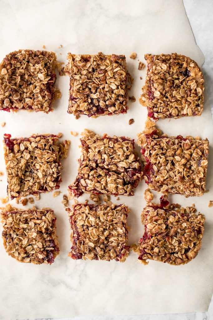 Easy cranberry sauce oat bars with a buttery crust, cranberry sauce filling, and crumbly pecan oat topping is the best way to use leftover cranberry sauce. | aheadofthyme.com