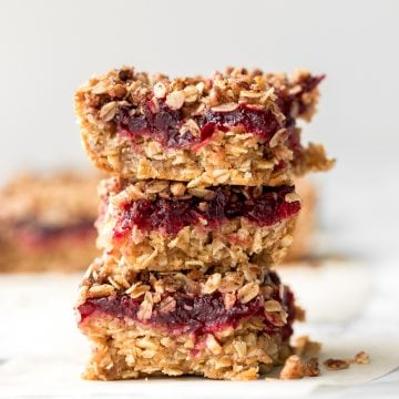 Easy cranberry sauce oat bars with a buttery crust, cranberry sauce filling, and crumbly pecan oat topping is the best way to use leftover cranberry sauce. | aheadofthyme.com