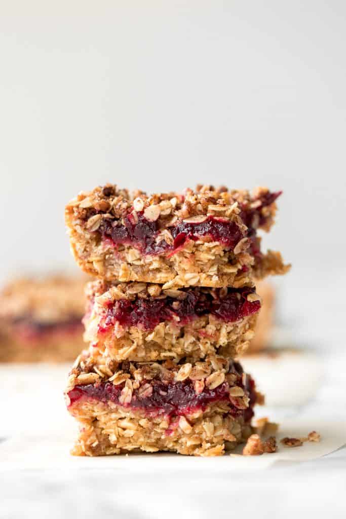 Easy cranberry sauce oat bars with a buttery crust, cranberry sauce filling, and crumbly pecan oat topping is the best way to use leftover cranberry sauce. | aheadofthyme.com