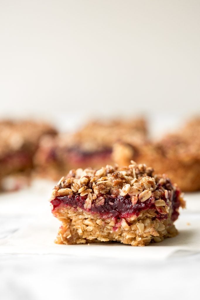 Easy cranberry sauce oat bars with a buttery crust, cranberry sauce filling, and crumbly pecan oat topping is the best way to use leftover cranberry sauce. | aheadofthyme.com