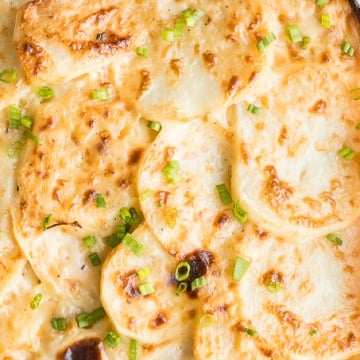 Rich and creamy potatoes au gratin is the ultimate comfort food made with sliced potatoes, cheese, and milk. It's the perfect side dish for the holidays. | aheadofthyme.com