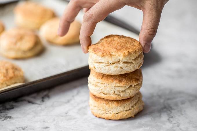 Flaky, fluffy, buttery, and soft, these easy homemade biscuits come together with only a handful of ingredients you already have at home! | aheadofthyme.com