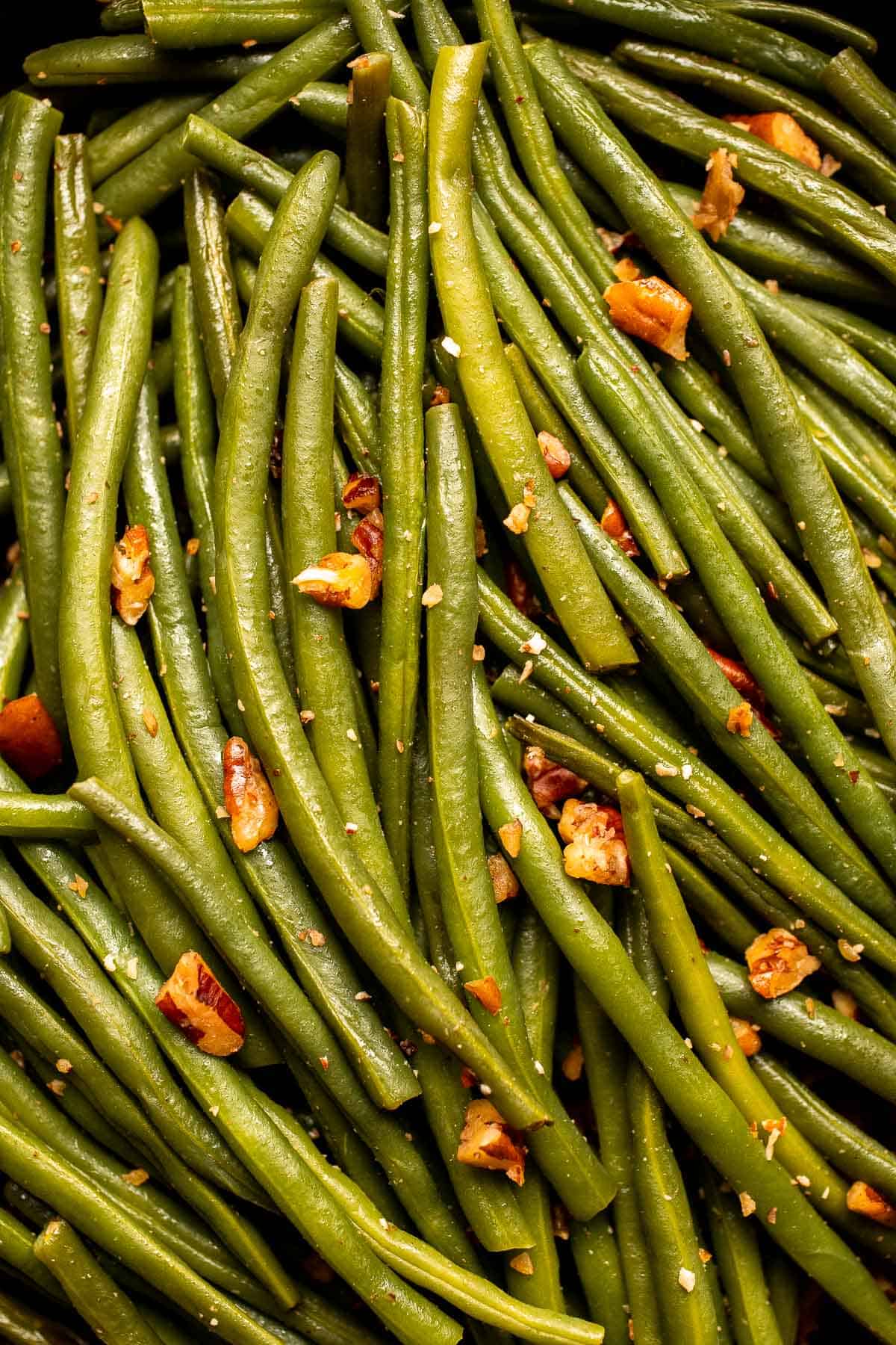 Green Beans with Pecans is a delicious and nutritious way to dress up earthy green beans with crunchy pecans. Serve this easy side dish any day! | aheadofthyme.com