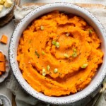 Creamy, buttery savory mashed sweet potatoes with garlic, herbs, and green onions is the perfect cozy side for dinner or holidays. | aheadofthyme.com