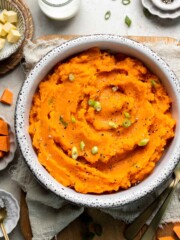Creamy, buttery savory mashed sweet potatoes with garlic, herbs, and green onions is the perfect cozy side for dinner or holidays. | aheadofthyme.com