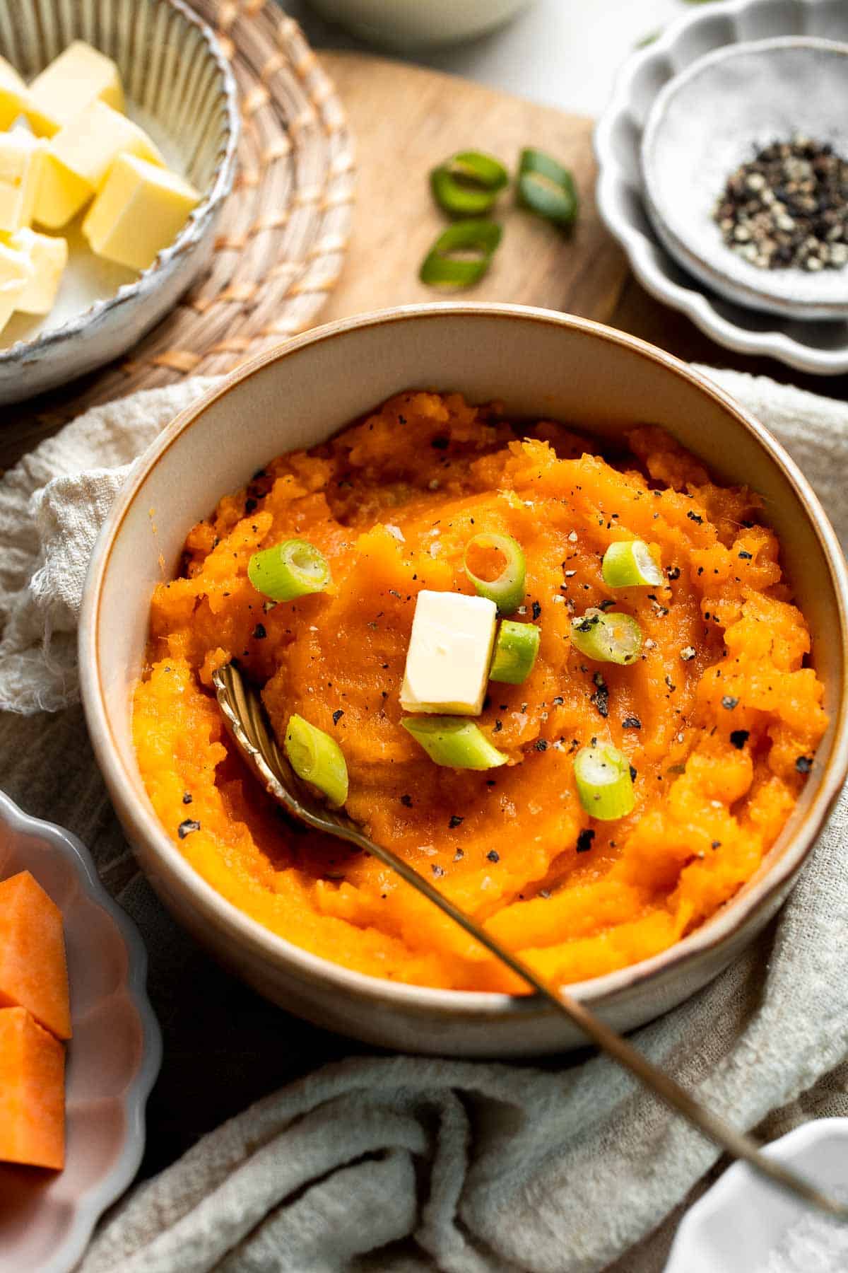 Creamy, buttery savory mashed sweet potatoes with garlic, herbs, and green onions is the perfect cozy side for dinner or holidays. | aheadofthyme.com