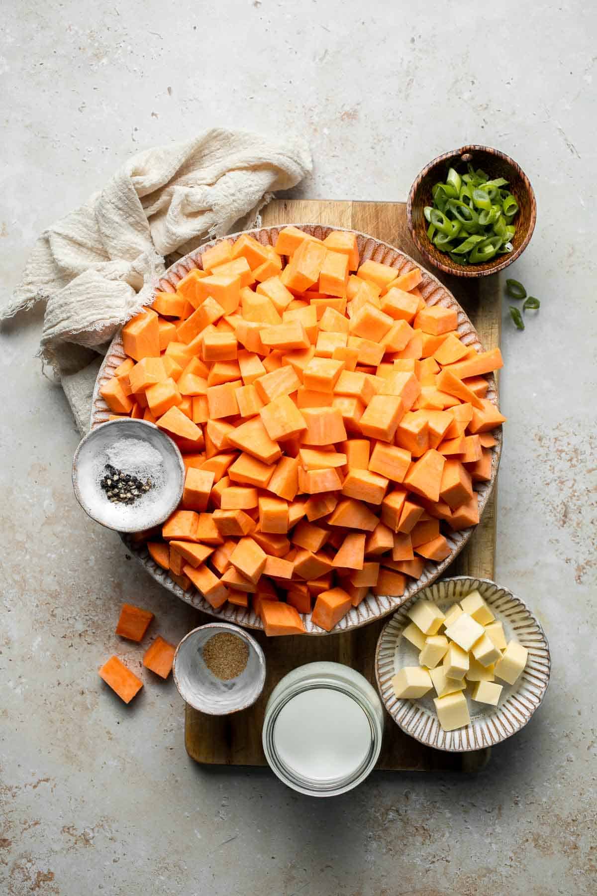 Creamy, buttery savory mashed sweet potatoes with garlic, herbs, and green onions is the perfect cozy side for dinner or holidays. | aheadofthyme.com
