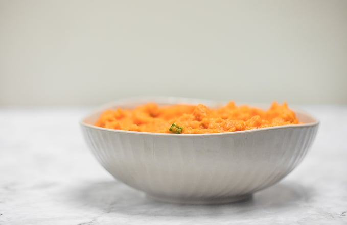 Velvety, smooth, and creamy, this savoury mashed sweet potatoes dish is quick and easy and can be made ahead of time -- it is the perfect side for your holiday meal. | aheadofthyme.com