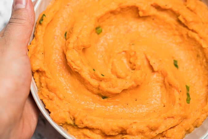 Velvety, smooth, and creamy, this savoury mashed sweet potatoes dish is quick and easy and can be made ahead of time -- it is the perfect side for your holiday meal. | aheadofthyme.com