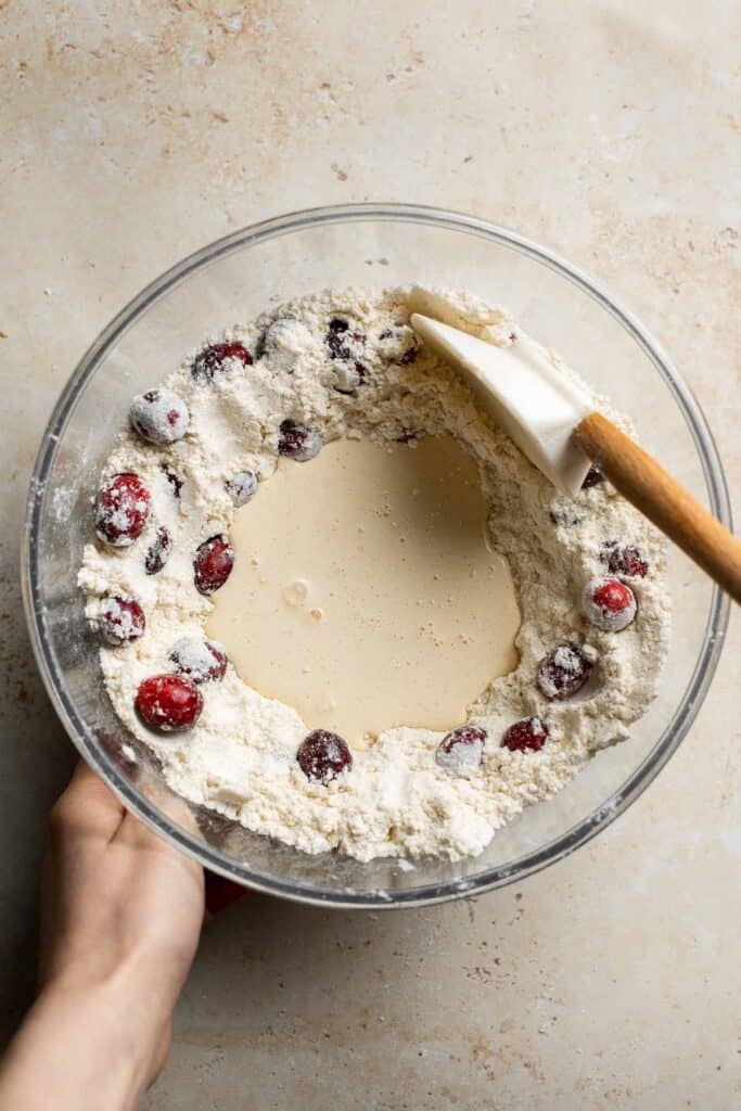 Cranberry Scones with Orange Glaze are a quick and easy holiday brunch recipe that is flavorful and flaky. They're soft and moist inside yet crisp outside. | aheadofthyme.com