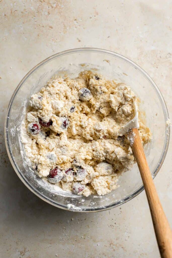 Cranberry Scones with Orange Glaze are a quick and easy holiday brunch recipe that is flavorful and flaky. They're soft and moist inside yet crisp outside. | aheadofthyme.com