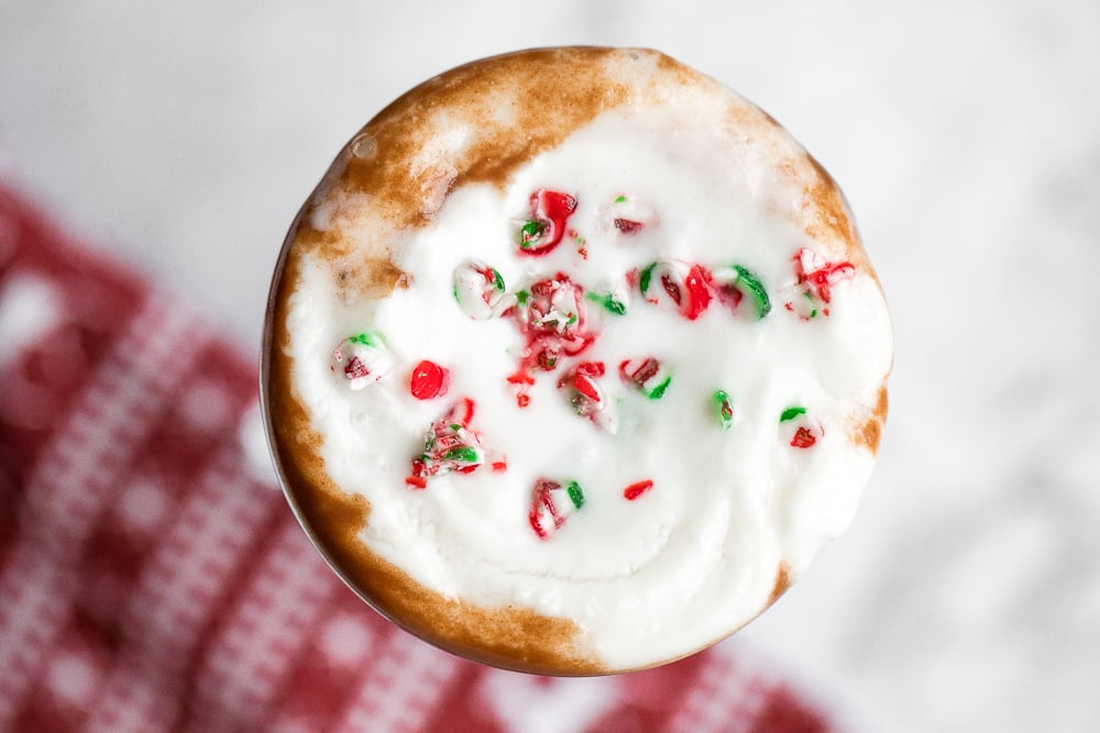 Make yourself a festive holiday drink in 5 minutes by combining creamy milk, chocolate, and minty candy canes for a cup of easy peppermint hot chocolate. | aheadofthyme.com