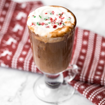 Make yourself a festive holiday drink in 5 minutes by combining creamy milk, chocolate, and minty candy canes for a cup of easy peppermint hot chocolate. | aheadofthyme.com