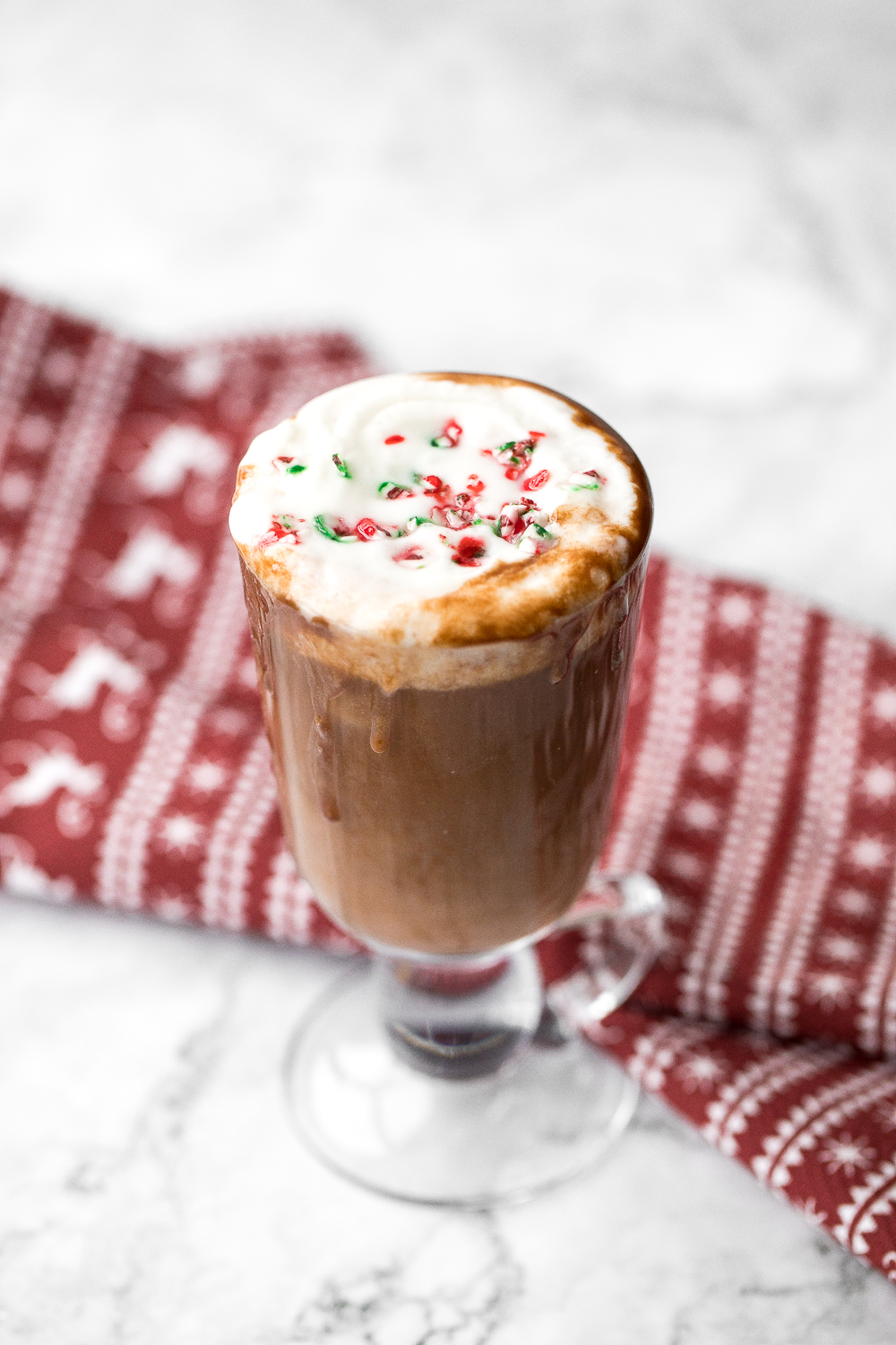Make yourself a festive holiday drink in 5 minutes by combining creamy milk, chocolate, and minty candy canes for a cup of easy peppermint hot chocolate. | aheadofthyme.com