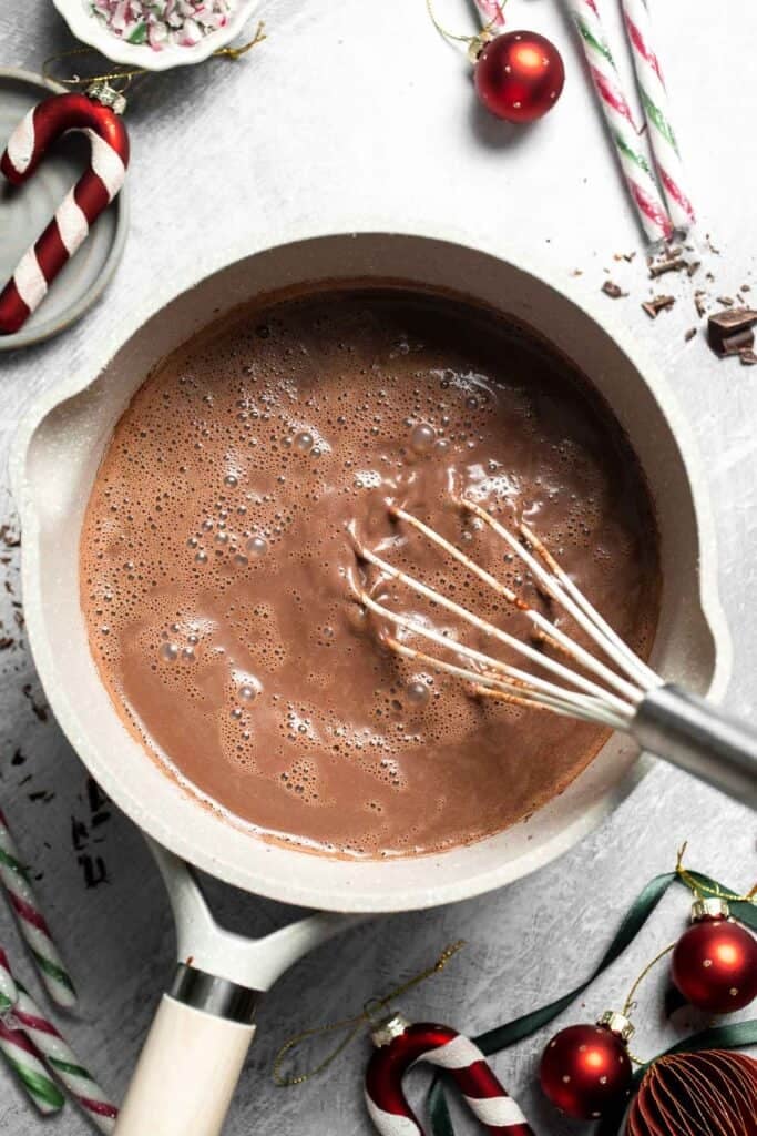Cozy, creamy peppermint hot chocolate made with real chocolate, warm milk, and a touch of peppermint extract. Perfect for winter nights and holiday treats. | aheaofthyme.com