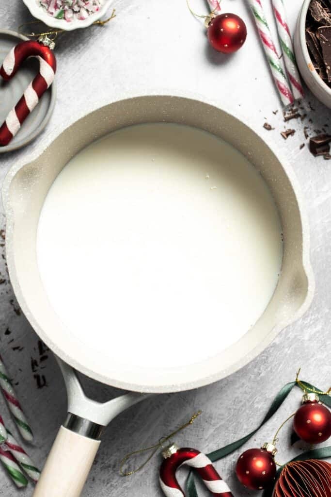 Cozy, creamy peppermint hot chocolate made with real chocolate, warm milk, and a touch of peppermint extract. Perfect for winter nights and holiday treats. | aheaofthyme.com