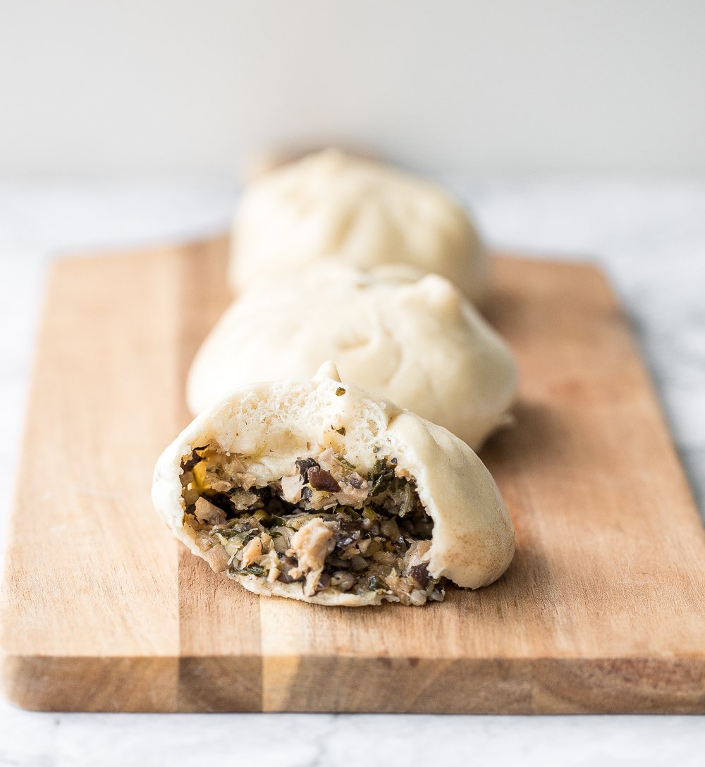 Homemade Shanghai style vegetarian steamed buns is spongy with a juicy, flavourful bok choy and mushroom filling inside bursting with Asian flavours. | aheadofthyme.com