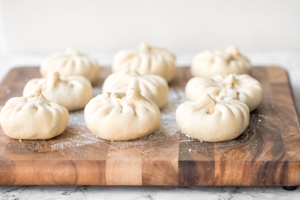 Homemade Shanghai style vegetarian steamed buns is spongy with a juicy, flavourful bok choy and mushroom filling inside bursting with Asian flavours. | aheadofthyme.com