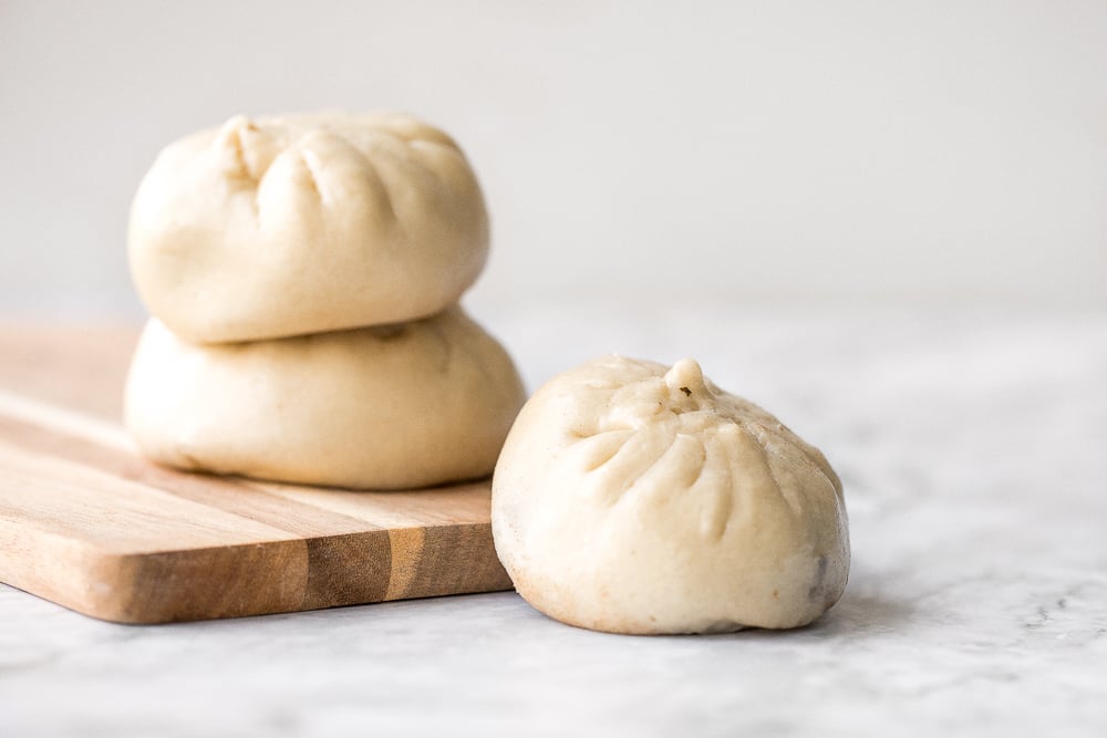 Homemade Shanghai style vegetarian steamed buns is spongy with a juicy, flavourful bok choy and mushroom filling inside bursting with Asian flavours. | aheadofthyme.com