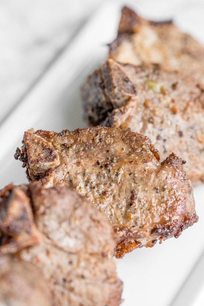 Juicy, tender, and delicious 18-minute air fryer lamb chops is marinated in a dijon sauce and will change the way you cook lamb forever! | aheadofthyme.com