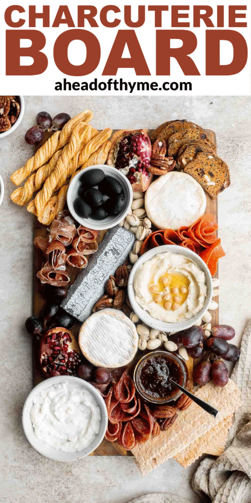 This easy charcuterie board is the perfect appetizer to impress with minimal effort— made with cheese, cured meats, crackers, dips, olives, fruit, and nuts. | aheadofthyme.com