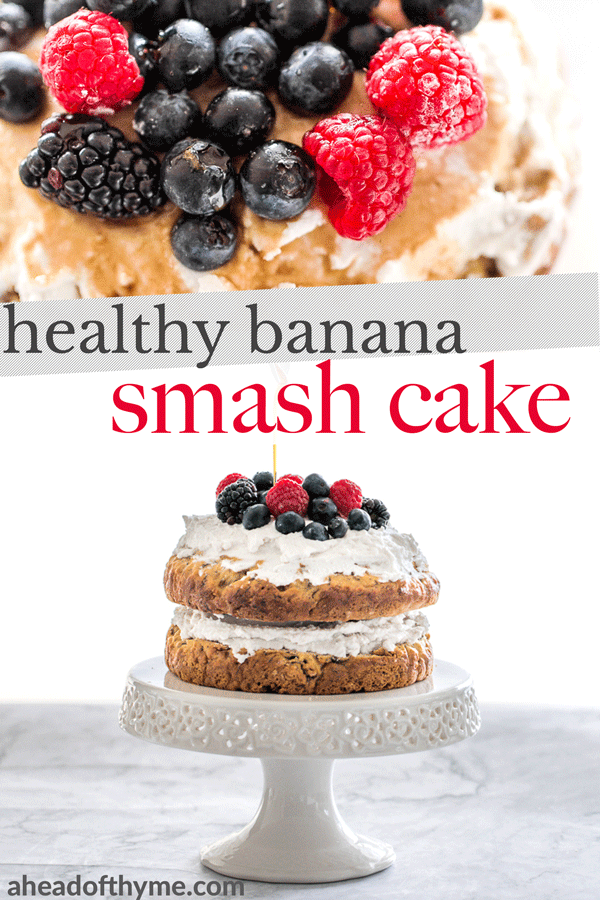 This healthy banana smash cake is held together with a whipped coconut cream frosting and topped with more cream, mixed berries and a drizzle of maple syrup. | aheadofthyme.com