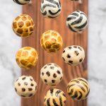 Bold safari animal print cake pops with vanilla cake and buttercream and coated in white chocolate will be the showstopper at your safari jungle party. | aheadofthyme.com