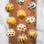 Bold safari animal print cake pops with vanilla cake and buttercream and coated in white chocolate will be the showstopper at your safari jungle party. | aheadofthyme.com