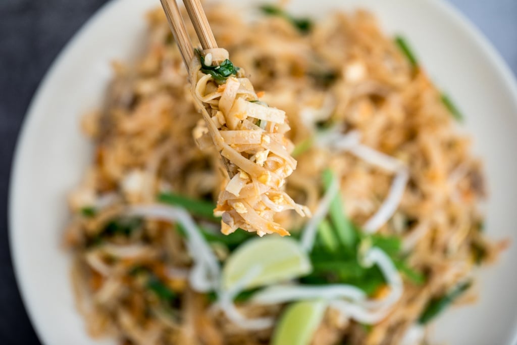 No more takeout when you can make flavourful, restaurant-style, authentic chicken Pad Thai at home in just 10 minutes. It's sweet, savoury, sour and nutty. | aheadofthyme.com