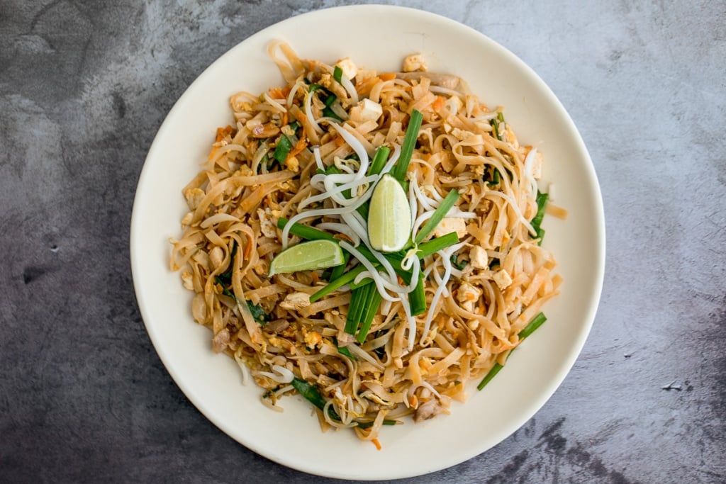 No more takeout when you can make flavourful, restaurant-style, authentic chicken Pad Thai at home in just 10 minutes. It's sweet, savoury, sour and nutty. | aheadofthyme.com