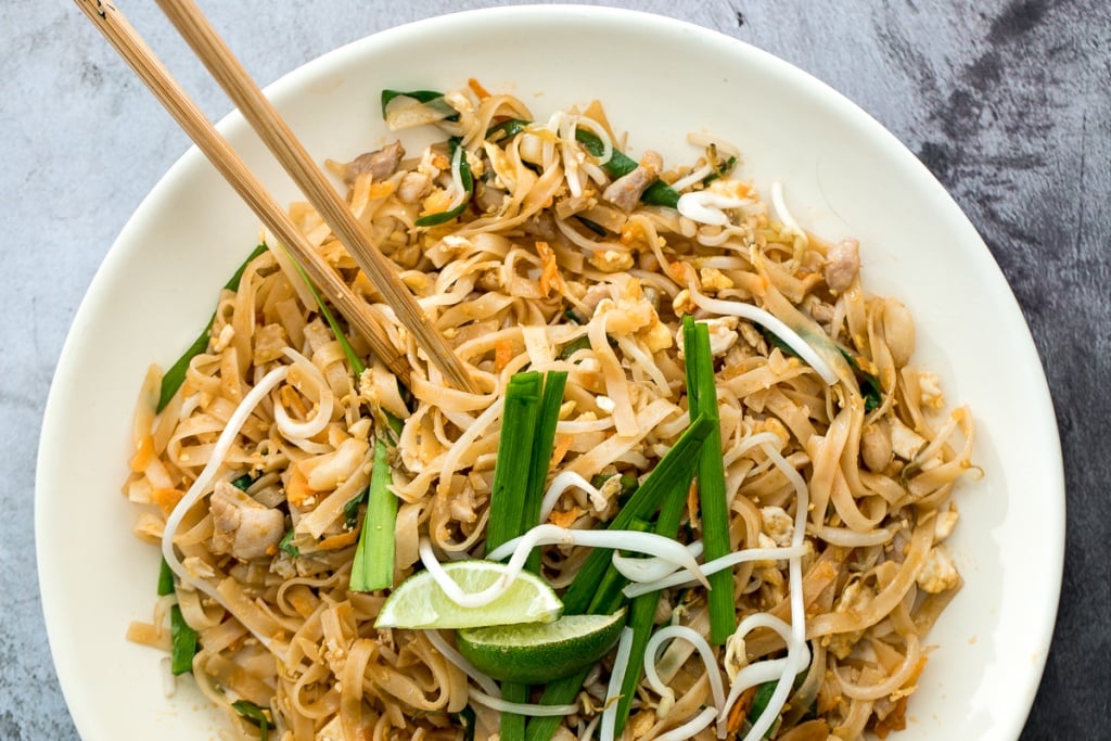 No more takeout when you can make flavourful, restaurant-style, authentic chicken Pad Thai at home in just 10 minutes. It's sweet, savoury, sour and nutty. | aheadofthyme.com