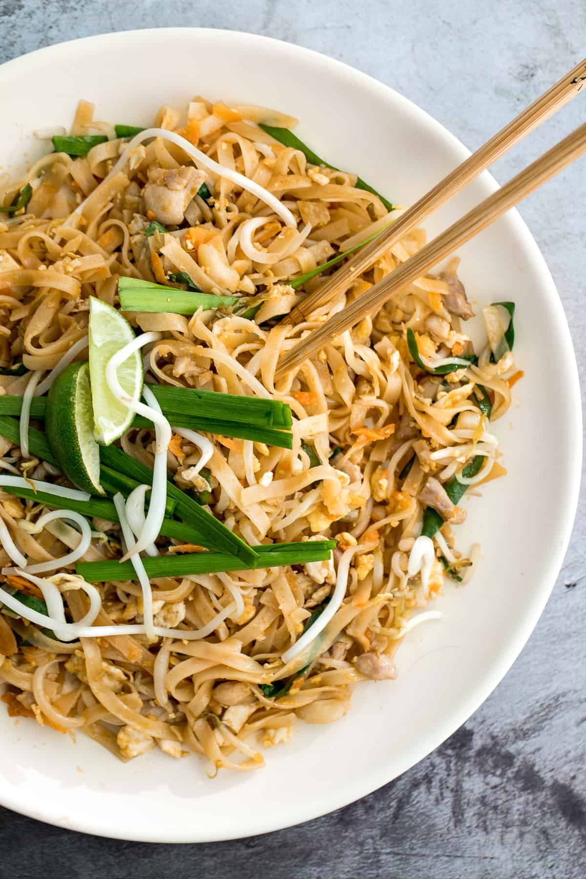 No more takeout when you can make flavourful, restaurant-style, authentic chicken Pad Thai at home in just 10 minutes. It's sweet, savoury, sour and nutty. | aheadofthyme.com