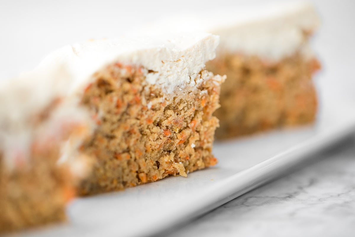 Super moist and perfectly spiced carrot cake with a creamy cheesecake topping is flavourful, comforting, and the perfect homemade spring dessert. | aheadofthyme.com