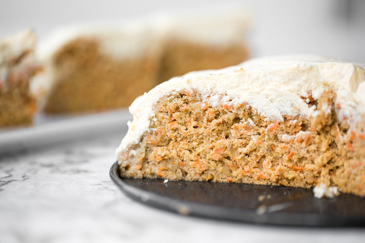 Super moist and perfectly spiced carrot cake with a creamy cheesecake topping is flavourful, comforting, and the perfect homemade spring dessert. | aheadofthyme.com