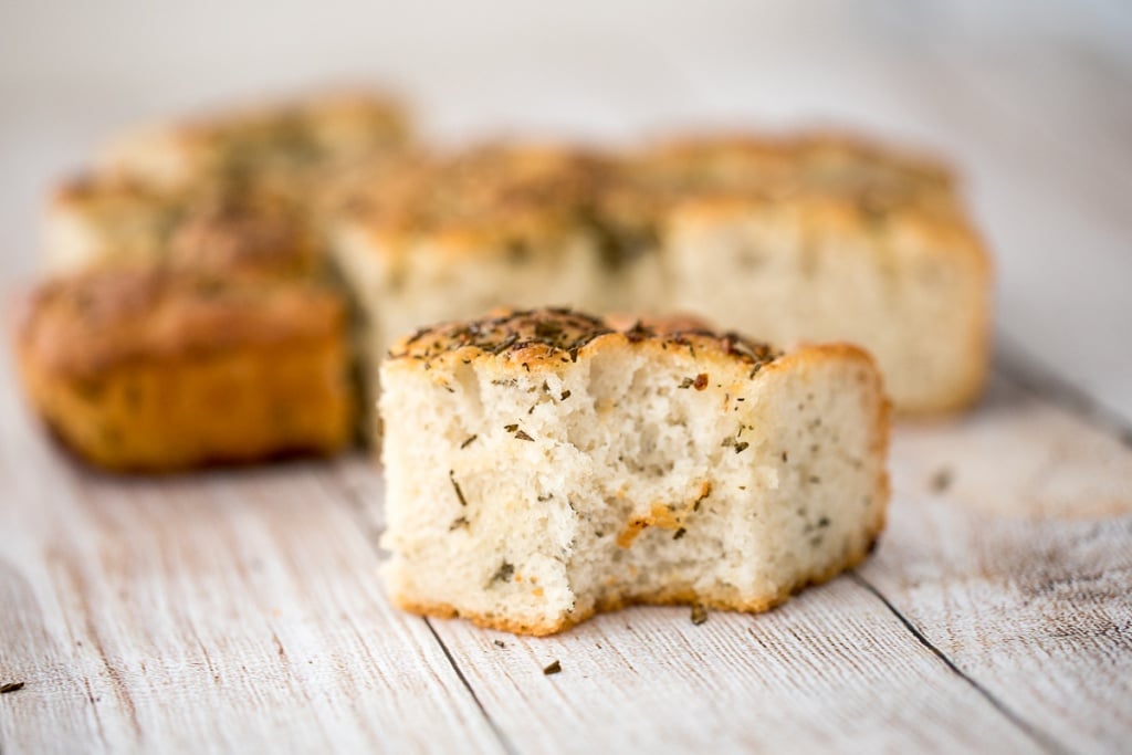 No knead, easy rosemary garlic focaccia bread is thick with a perfect golden and crispy texture on the outside, but soft, fluffy and tender inside. | aheadofthyme.com