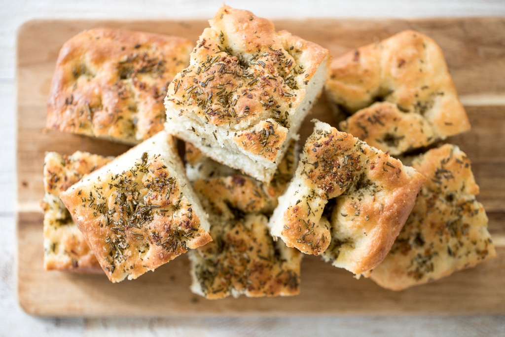 No knead, easy rosemary garlic focaccia bread is thick with a perfect golden and crispy texture on the outside, but soft, fluffy and tender inside. | aheadofthyme.com