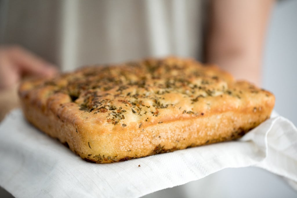 No knead, easy rosemary garlic focaccia bread is thick with a perfect golden and crispy texture on the outside, but soft, fluffy and tender inside. | aheadofthyme.com