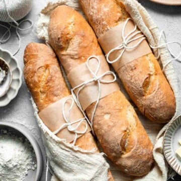 These homemade no knead French Baguettes are just what bread dreams are made of — beautifully golden loaves with a crisp crust and soft, airy interior. | aheadofthyme.com