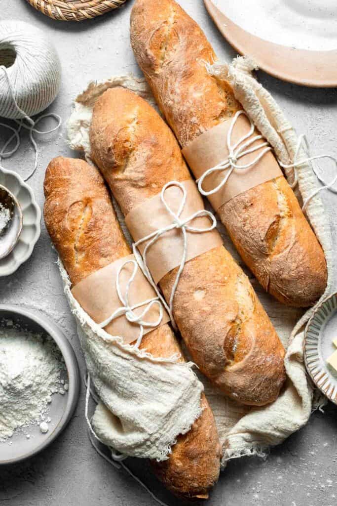 These homemade no knead French Baguettes are just what bread dreams are made of — beautifully golden loaves with a crisp crust and soft, airy interior. | aheadofthyme.com