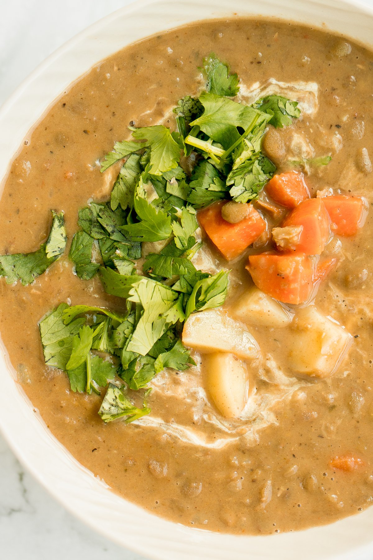 Indian-inspired, creamy coconut curry lentil soup is an easy and simple 30-minute pantry meal that is packed with spices for maximum flavour. | aheadofthyme.com