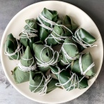 Zongzi Chinese tamales (粽子) or sticky rice dumplings are stuffed with sticky rice, pork belly, and shiitake mushrooms, wrapped inside reed or bamboo leaves. | aheadofthyme.com