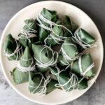 Zongzi Chinese tamales (粽子) or sticky rice dumplings are stuffed with sticky rice, pork belly, and shiitake mushrooms, wrapped inside reed or bamboo leaves. | aheadofthyme.com