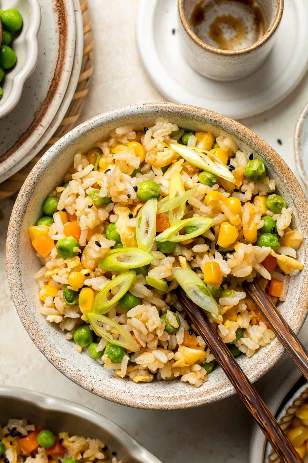 Say goodbye to takeout and make flavourful, Chinese restaurant-style vegetarian fried rice at home in 10 minutes, with fully customizable ingredients. | aheadofthyme.com