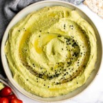 Quick and easy avocado hummus is creamy, smooth, healthy, and delicious. Loaded with chickpeas and avocado, it's the perfect blend of hummus and guacamole. | aheadofthyme.com