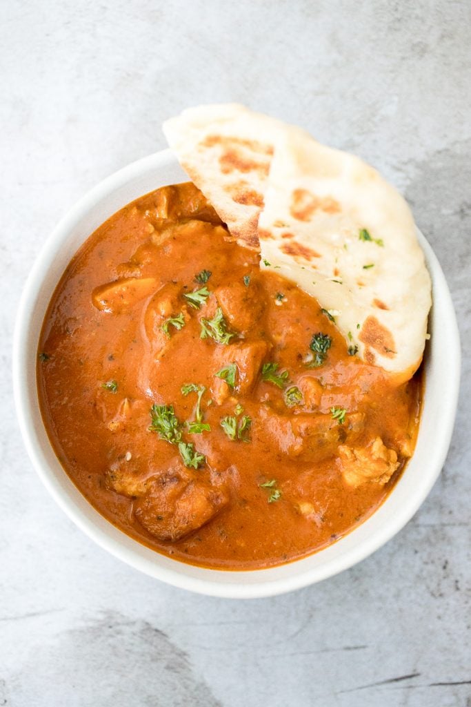 Better than takeout, make easy Indian butter chicken in just 30 minutes, with a creamy tomato-based sauce, charred chicken, and incredible spice + flavour. | aheadofthyme.com