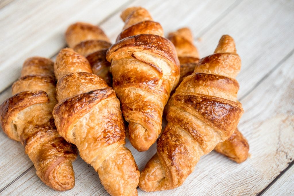 Quick and easy butter croissants are flaky, buttery, airy, and authentic, and are made in the fraction of the time using a special simplified technique. | aheadofthyme.com