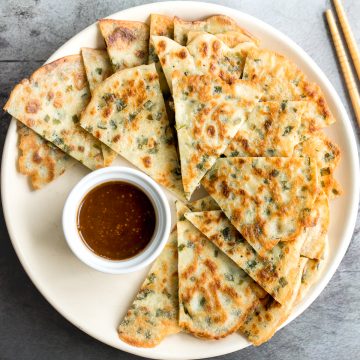 Don't let your sourdough starter go to waste, use your discard to make this easy one bowl recipe for crispy, light and fluffy, savoury chive pancakes. | aheadofthyme.com
