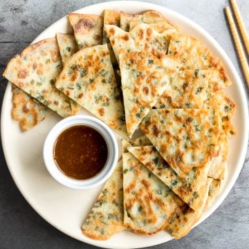 Don't let your sourdough starter go to waste, use your discard to make this easy one bowl recipe for crispy, light and fluffy, savoury chive pancakes. | aheadofthyme.com