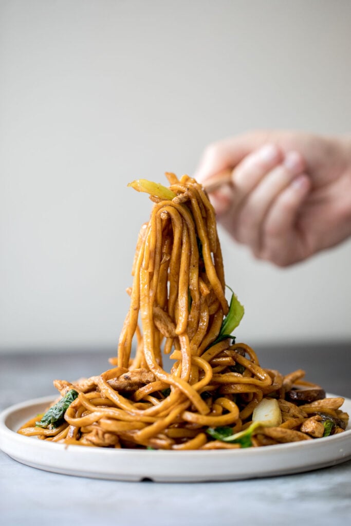 Better than take-out, flavourful and authentic Shanghai fried noodles with chicken, mushrooms, and bok choy is made in just 10 minutes - the easiest dinner! | aheadofthyme.com