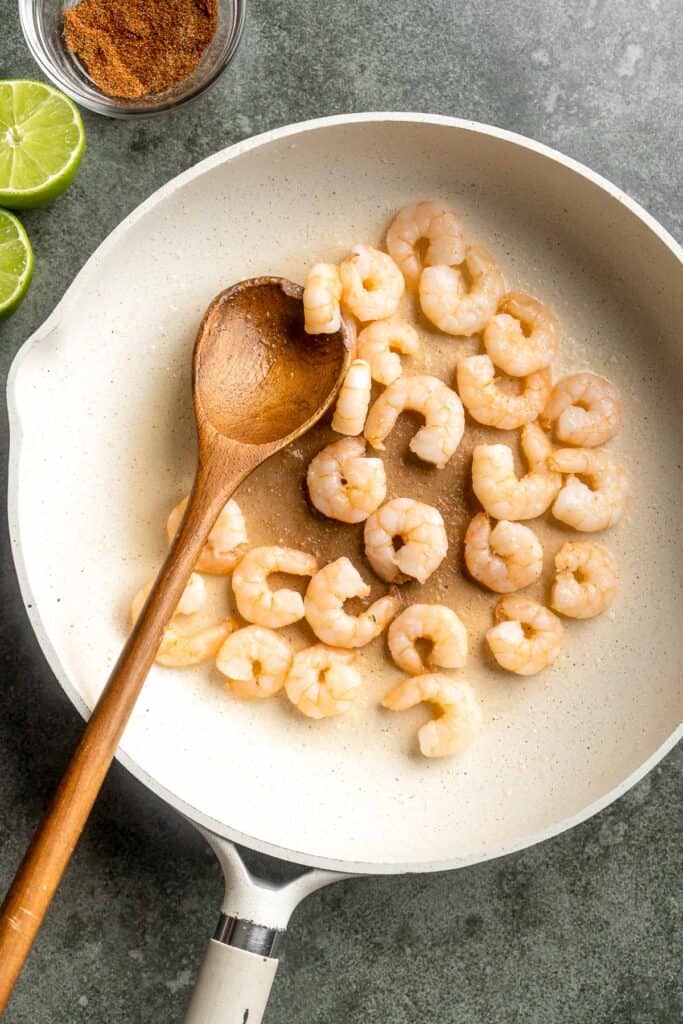 Quick and easy Shrimp Tacos with Lime Crema slaw are made with soft tortillas, seasoned shrimp, and creamy cabbage slaw — and ready in about 20 minutes! | aheadofthyme.com